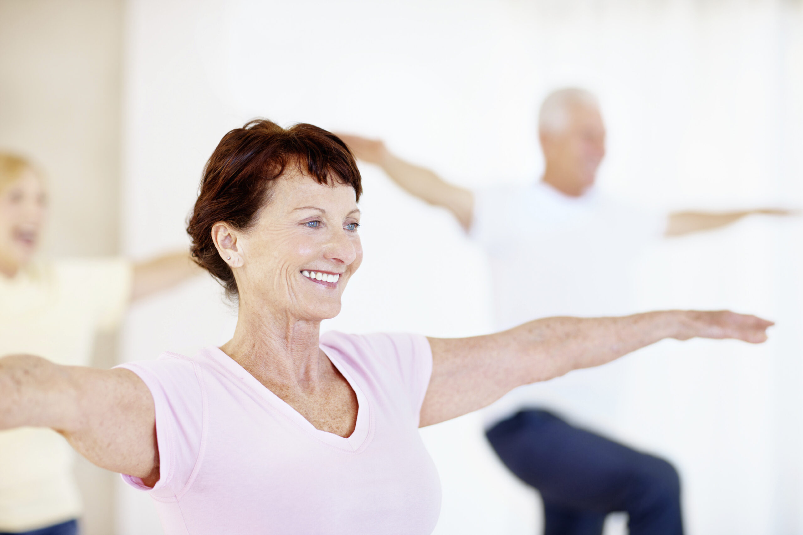 Shot of a group of seniors enjoying a yoga class together